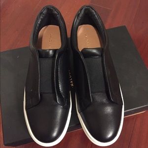 Brand new, halogen slip on sneakers in black